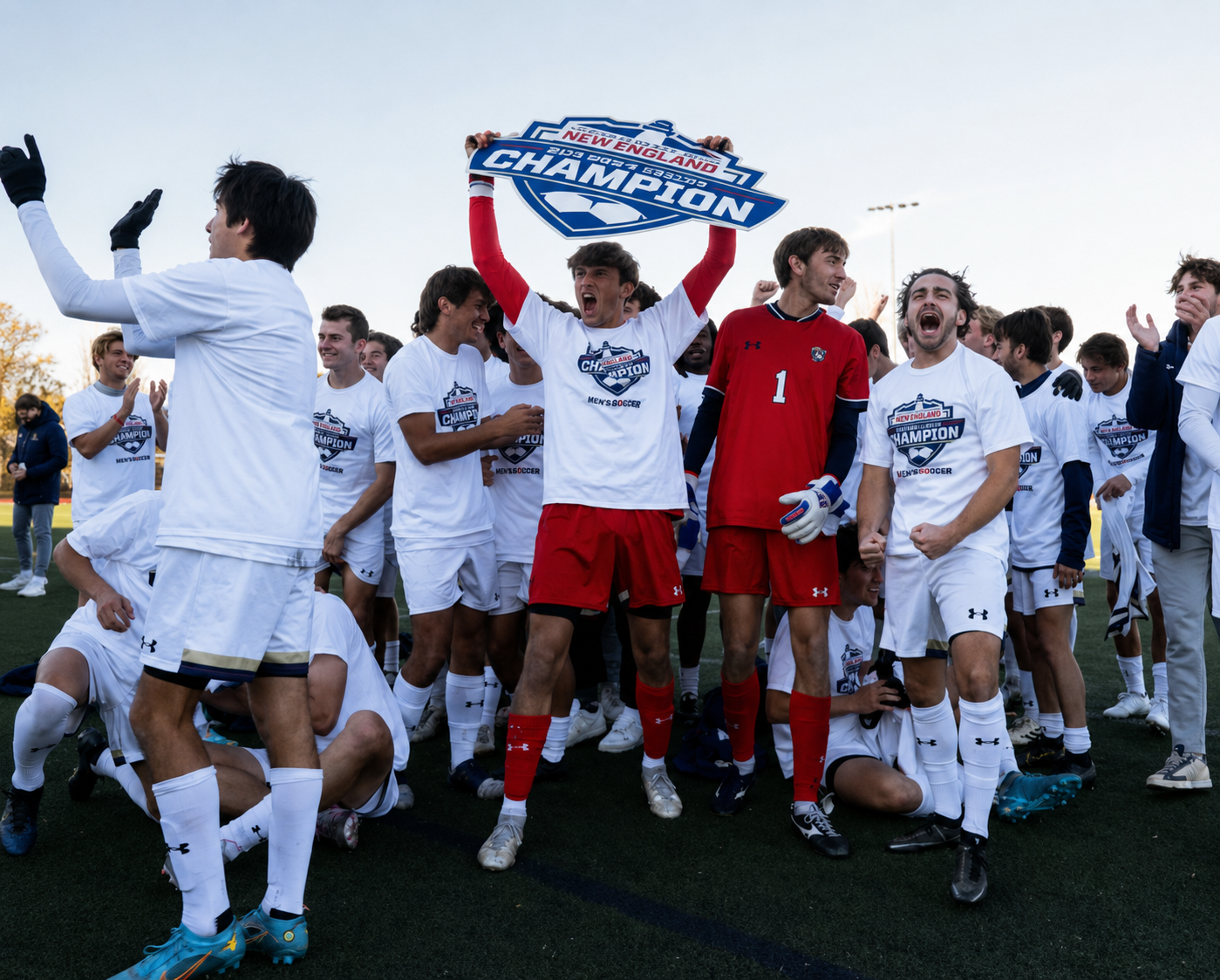 Team celebrating championship with sign